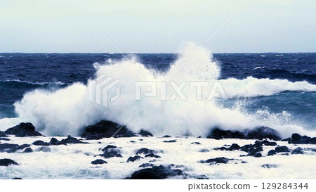White waves crashing violently against the reef White waves crashing violently against the reef 129284344