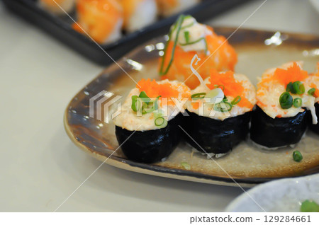 maki , Japanese roll or rice roll or seaweed roll with shrimp egg maki , Japanese roll or rice roll or seaweed roll with shrimp egg 129284661