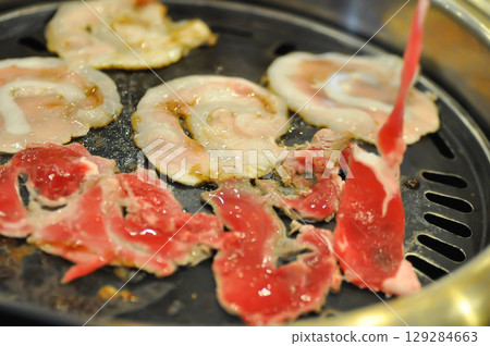 barbecued beef or grilled beef and grilled pork on the broiler or Korean bbq barbecued beef or grilled beef and grilled pork on the broiler or Korean bbq 129284663