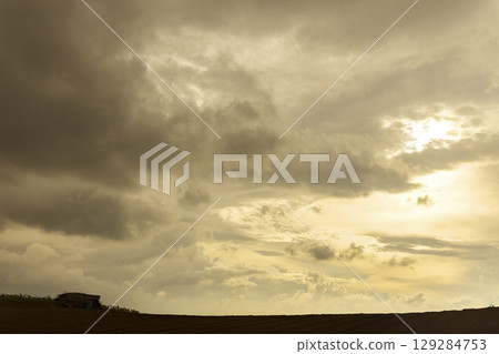 Dramatic Sky with Storm Clouds and Sunlight Dramatic Sky with Storm Clouds and Sunlight 129284753