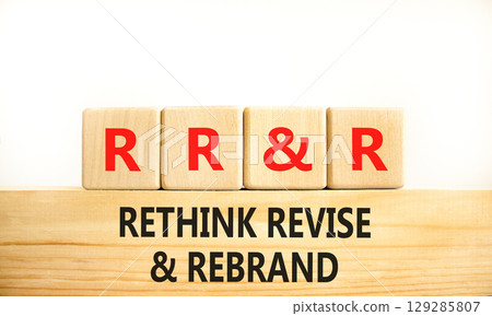 Rethink revise rebrand symbol. Concept word Rethink Revise and Rebrand on beautiful wooden blocks. Beautiful white background. Business brand rethink revise rebrand concept. Copy space. 129285807