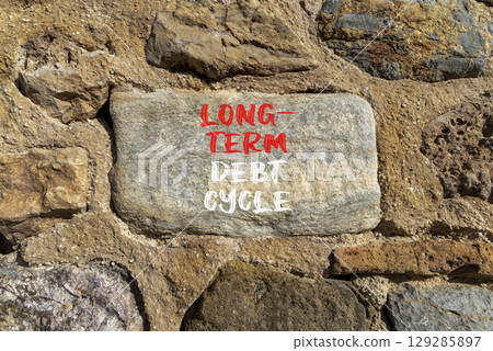 Long-term debt cycle symbol. Concept words Long-term debt cycle on beautiful big grey stone. Beautiful stone wall background. Business Long-term debt cycle concept. Copy space. Long-term debt cycle symbol. Concept words Long-term debt cycle on beautiful big grey stone. Beautiful stone wall background. Business Long-term debt cycle concept. Copy space. 129285897