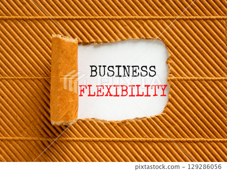 Business flexibility symbol. Concept words Business flexibility on beautiful white paper. Beautiful brown paper background. Business flexibility concept. Copy space. 129286056