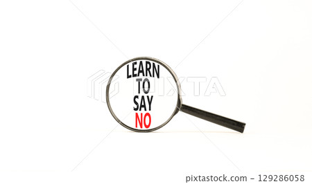 Learn to say no symbol. Concept words phrase Learn to say no in beautiful black magnifying glass. Beautiful white background. Business psychological Learn to say no concept. Copy space. Learn to say no symbol. Concept words phrase Learn to say no in beautiful black magnifying glass. Beautiful white background. Business psychological Learn to say no concept. Copy space. 129286058