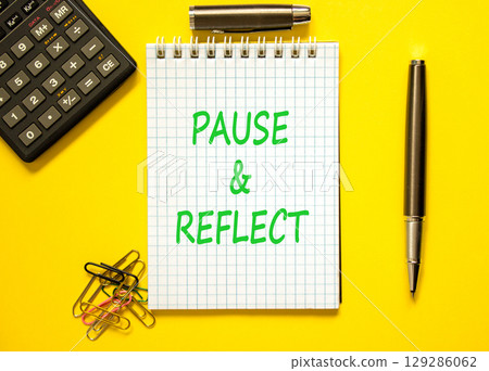 Pause and reflect symbol. Concept words Pause and reflect on beautiful note. Black pen. Calculator. Beautiful yellow background. Business motivational lifestyle pause and reflect concept. Copy space. 129286062