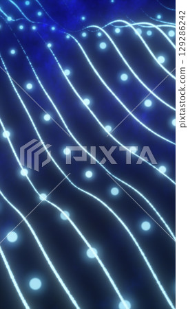 Abstract glowing blue grid with light nodes flowing in wave-like formation on a dark background 129286242