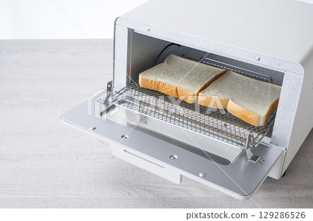 Toast bread in a toaster oven Toast bread in a toaster oven 129286526