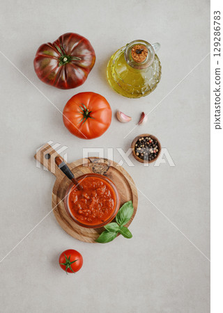 Traditional tomato sauce in a glass jar top view 129286783