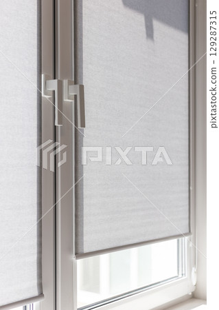 Heat Reducing Roller Blinds for Sunny Windows 129287315