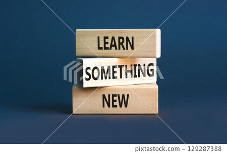 Learn something new symbol. Concept words Learn something new on beautiful block. Beautiful grey table grey background. Business motivational lifestyle learn something new concept Copy space 129287388