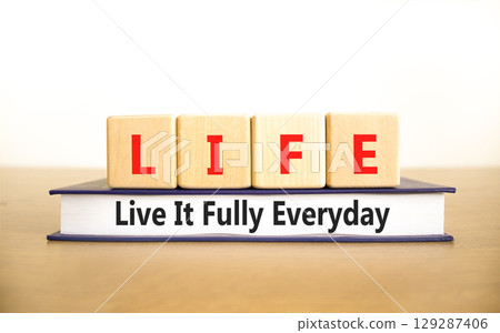 LIFE live it fully everyday symbol. Concept word LIFE Live It Fully Everyday on beautiful blocks. Beautiful white background. Business motivational LIFE live it fully everyday concept. Copy space. LIFE live it fully everyday symbol. Concept word LIFE Live It Fully Everyday on beautiful blocks. Beautiful white background. Business motivational LIFE live it fully everyday concept. Copy space. 129287406