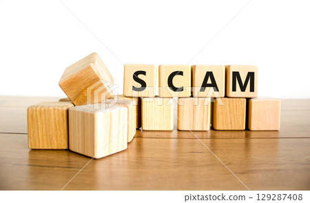 Scam symbol. Concept word Scam on beautiful wooden blocks. Beautiful wooden table white background. Business, lifestyle, support and scam concept. Copy space. Scam symbol. Concept word Scam on beautiful wooden blocks. Beautiful wooden table white background. Business, lifestyle, support and scam concept. Copy space. 129287408