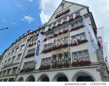 Munich, Germany - July 27, 2025: The building of the men's clothing store in the main square of the city, Hirmer big and tall, a retailer specializing in plus-size menswear Munich, Germany - July 27, 2025: The building of the men's clothing store in the main square of the city, Hirmer big and tall, a retailer specializing in plus-size menswear 129287446