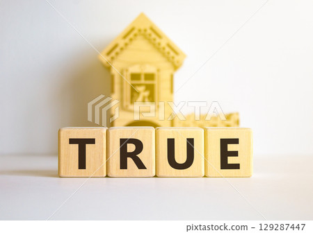 True symbol. Concept word True on beautiful wooden blocks. Beautiful white table white background. Wooden beautiful house. Business, lifestyle, support and true concept. Copy space. True symbol. Concept word True on beautiful wooden blocks. Beautiful white table white background. Wooden beautiful house. Business, lifestyle, support and true concept. Copy space. 129287447