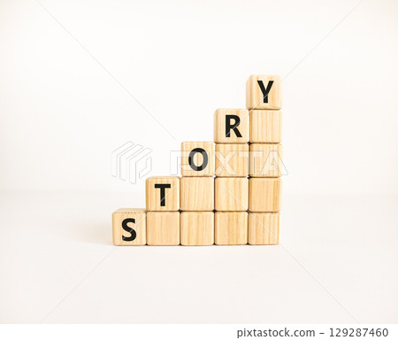 Story symbol. Concept word Story on beautiful wooden blocks. Beautiful white table white background. Business lifestyle story concept. Copy space. 129287460