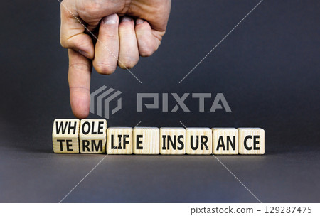 Term or whole life insurance symbol. Concept words Term life insurance or Whole life insurance on wooden blocks. Beautiful grey background. Business term or whole life insurance concept. Copy space. 129287475