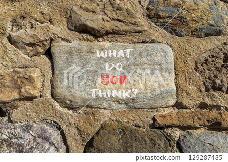 What do you think symbol. Concept words What do you think on beautiful grey stone. Beautiful stone wall background. Business and What do you think concept. Copy space. 129287485