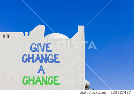 Give change a chance symbol. Concept words phrase Give change a chance on beautiful white wall. Beautiful white wall and blue sky background. Business Give change a chance concept. Copy space. Give change a chance symbol. Concept words phrase Give change a chance on beautiful white wall. Beautiful white wall and blue sky background. Business Give change a chance concept. Copy space. 129287487