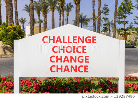 Challenge choice change chance symbol. Concept words Challenge choice change chance on beautiful road sign. Beautiful palm tree background. Business Challenge choice change chance concept. Copy space. 129287490
