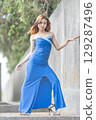Elegant Woman in Blue Strapless Gown Posing 129287496