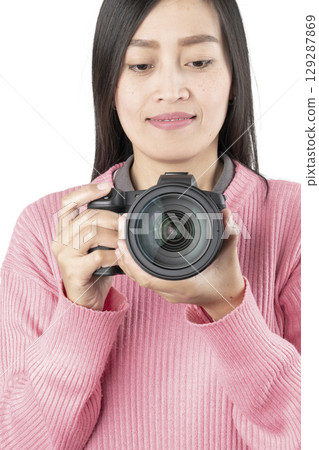 Woman Holding Black Mirrorless Camera Front View (Isolated) Woman Holding Black Mirrorless Camera Front View (Isolated) 129287869