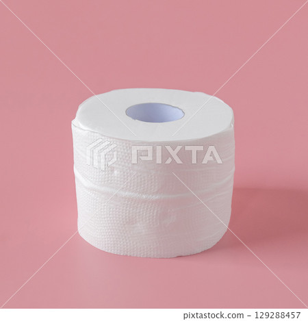 Tissue rolls of toilet paper lying on pink background. 129288457