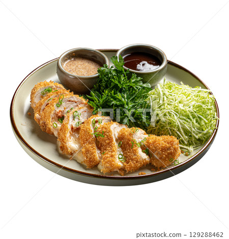 Isolated plate of chicken katsu with cabbage 129288462