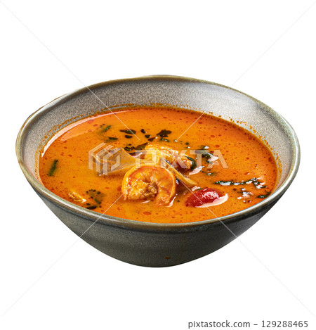 Isolated bowl of spicy thai seafood soup with shrimp Isolated bowl of spicy thai seafood soup with shrimp 129288465