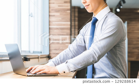 Male businessman using a laptop Male businessman using a laptop 129288614