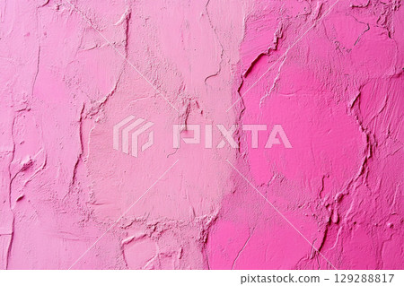 A close-up of a weathered, cracked wall with peeling paint, showing a textured surface in various shades of pink and light purple. 129288817