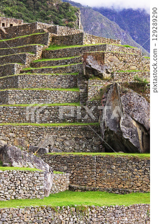 Stone walls of Machu Picchu ruins, Peru, South America 129289290