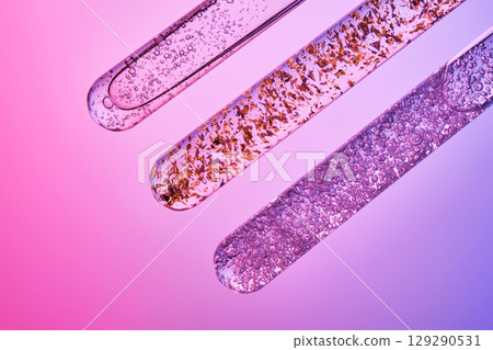 Serums in test tubes in the photo with the spirit of experimentation and technology. Serums in test tubes in the photo with the spirit of experimentation and technology. 129290531