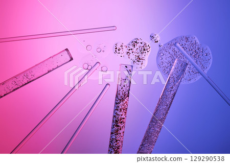 Test tubes with serums and various scientific laboratory supplies on a blue-purple background. Test tubes with serums and various scientific laboratory supplies on a blue-purple background. 129290538