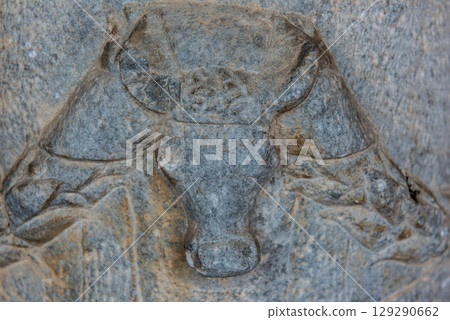 Greek sculpture of a bull. Greek elements of architectural decorations of buildings, columns 129290662