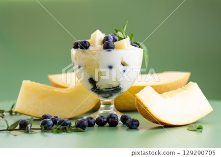 Diet fruit yogurt with melon blueberries and aromatic greens Diet fruit yogurt with melon blueberries and aromatic greens 129290705
