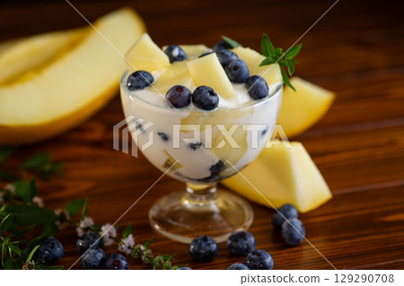 Healthy breakfast yogurt melon blueberry on wooden 129290708