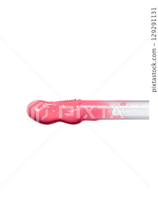Close-up of lip gloss applicator with pink shimmer, glossy makeup product isolated on transparent background Close-up of lip gloss applicator with pink shimmer, glossy makeup product isolated on transparent background 129291131