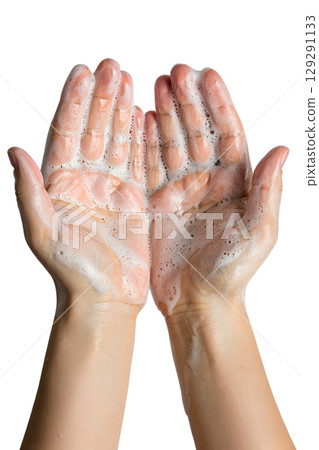 Close-up of soapy hands being washed, healthcare hygiene ritual to stop virus spread isolated 129291133