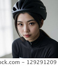 portrait of a young Japanese woman cyclist with helmet on 129291209