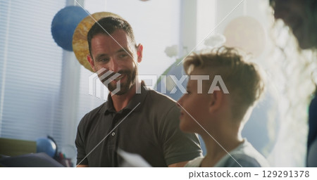 Parents Evening: Parents Happy About Excellent Academic Performance of Their Son 129291378