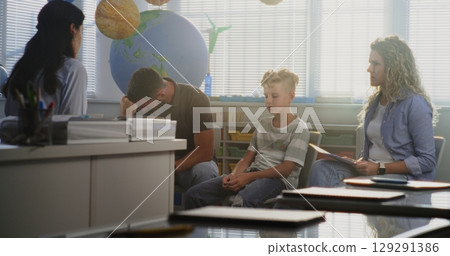 Teacher and Parents Discussing Academic Failure of Primary School Student, Finding Solutions 129291386