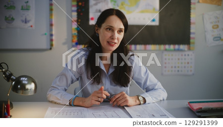 Female Teacher Praising Boy for Academic Progress and High Grades in Front of His Parents Female Teacher Praising Boy for Academic Progress and High Grades in Front of His Parents 129291399