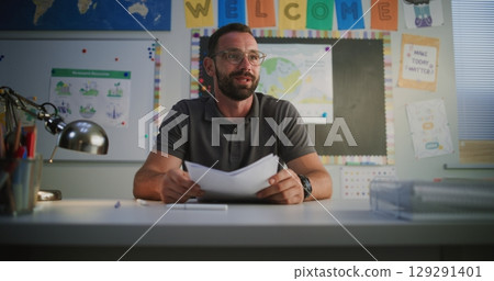 Male Teacher Giving School Test Results of Student to His Mother, Praising Boy for High Grades Male Teacher Giving School Test Results of Student to His Mother, Praising Boy for High Grades 129291401