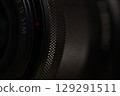 Close-Up of Textured Camera Lens Focus Ring Detail 129291511
