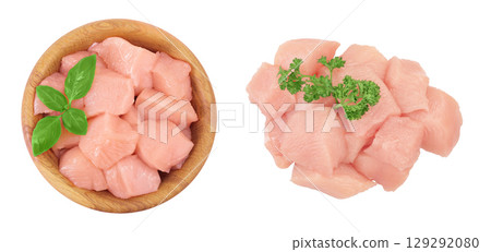 Raw diced chicken fillet in wooden bowl isolated on white background. Top view. Flat lay 129292080