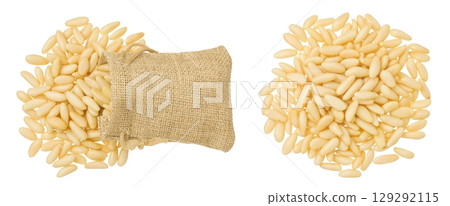 Shelled European pine nuts in a bag isolated on white background with full depth of field. Top view. Flat lay Shelled European pine nuts in a bag isolated on white background with full depth of field. Top view. Flat lay 129292115