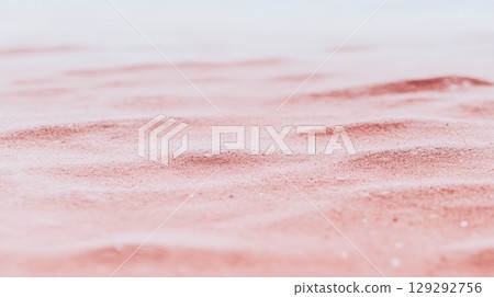 Unique pink salt flats stretching across the landscape near dusk 129292756