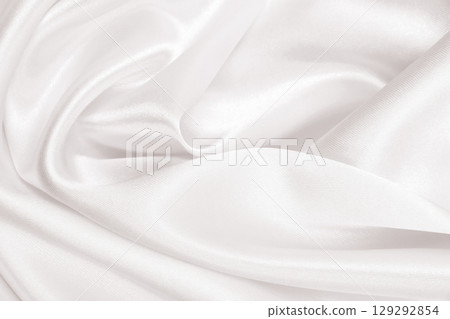 Smooth elegant golden silk or satin luxury cloth texture as wedding background. Luxurious background design. In Sepia toned. Retro style Smooth elegant golden silk or satin luxury cloth texture as wedding background. Luxurious background design. In Sepia toned. Retro style 129292854