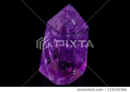 Macro mineral stone Amethyst crystal on a black background 129292966