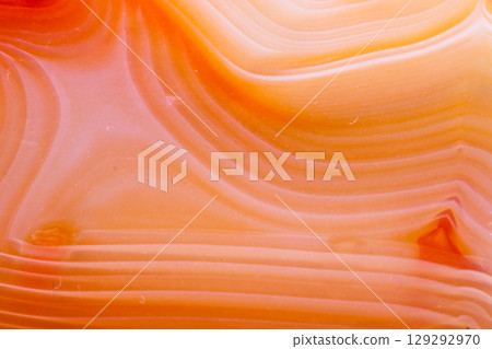 Macro mineral orange agate in crystals on white background 129292970